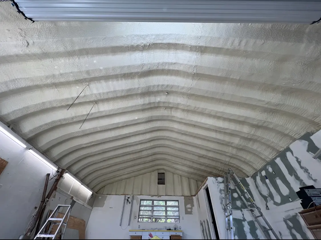 Spray polyurethane foam applied to the underside of a metal roof deck in West Lealman